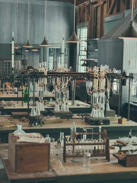 The old science laboratory: benches of glassware under hanging lamps.
