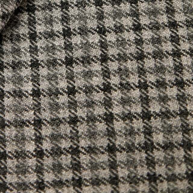 Grey and fawn dogtooth overcoating, a small broken check, crisp to the thread.